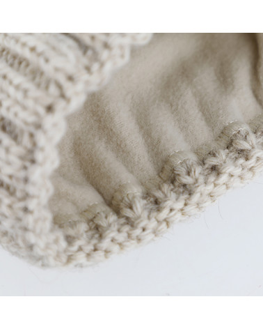 Bonnet tricot à torsades avec pompon fourrure synthétique Curry